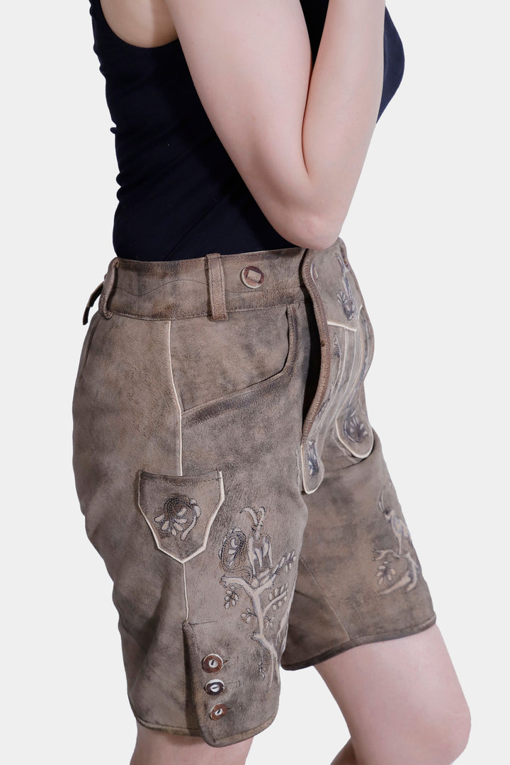 Side view of Amy Adams Lederhosen showing detailed embroidery, front pockets, and side knife pocket