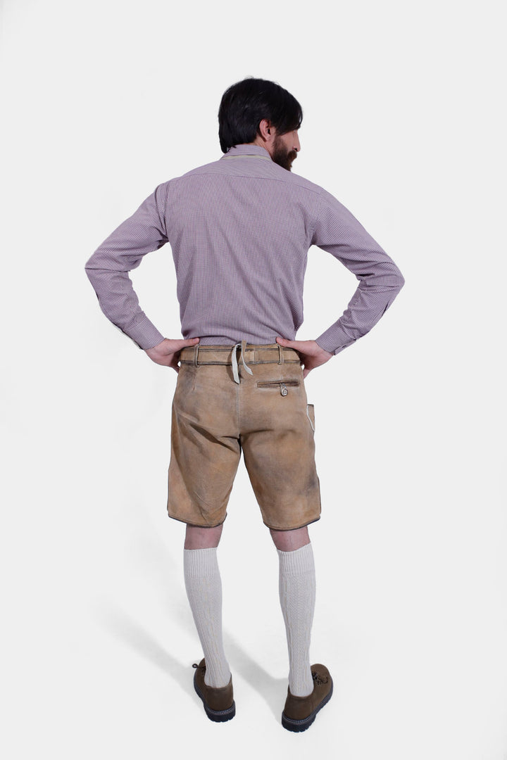 Rear view of man wearing Boris Becker Lederhosen, hands on hips, showcasing the back design.