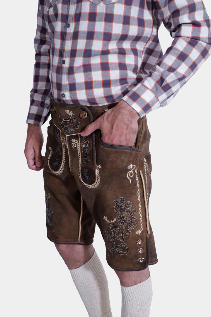 Man posing in "Chestnut Oak" lederhosen, paired with a checkered shirt