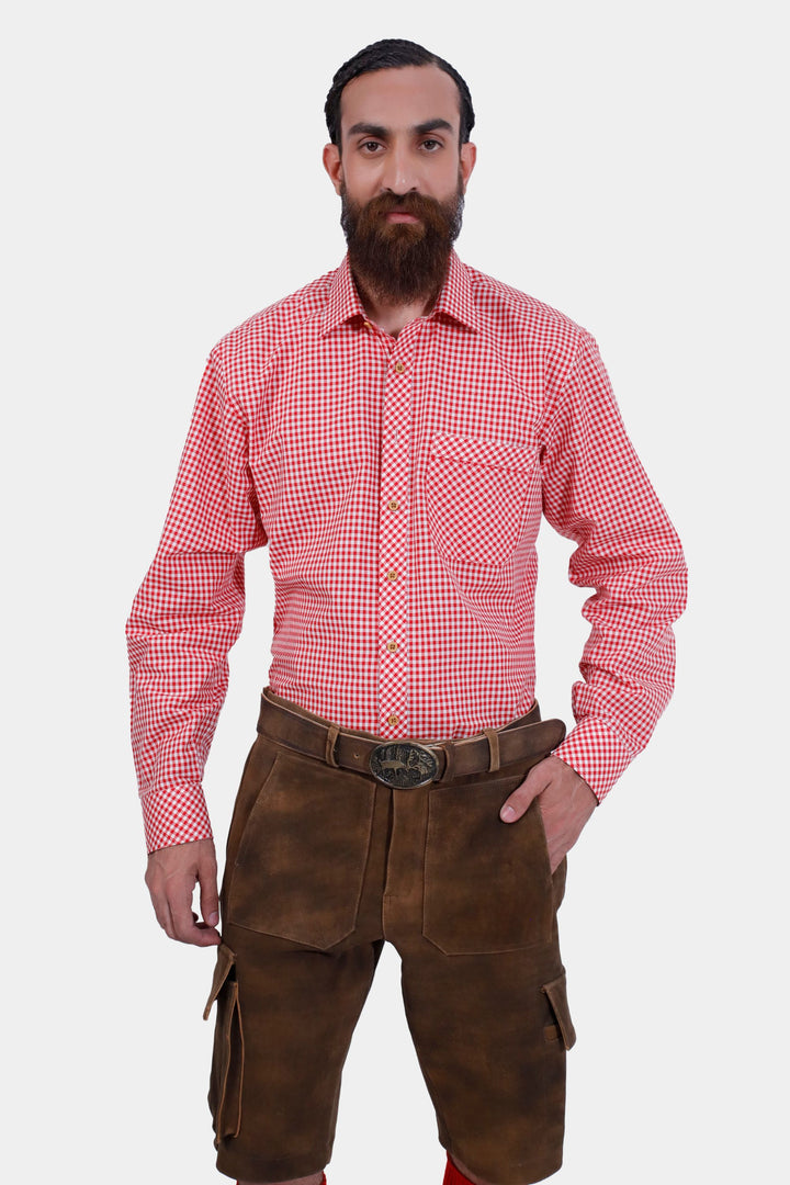  Front view of a man in a red checkered shirt and DJ Ötzi Cargo Lederhosen, showcasing the detailed design and fit.