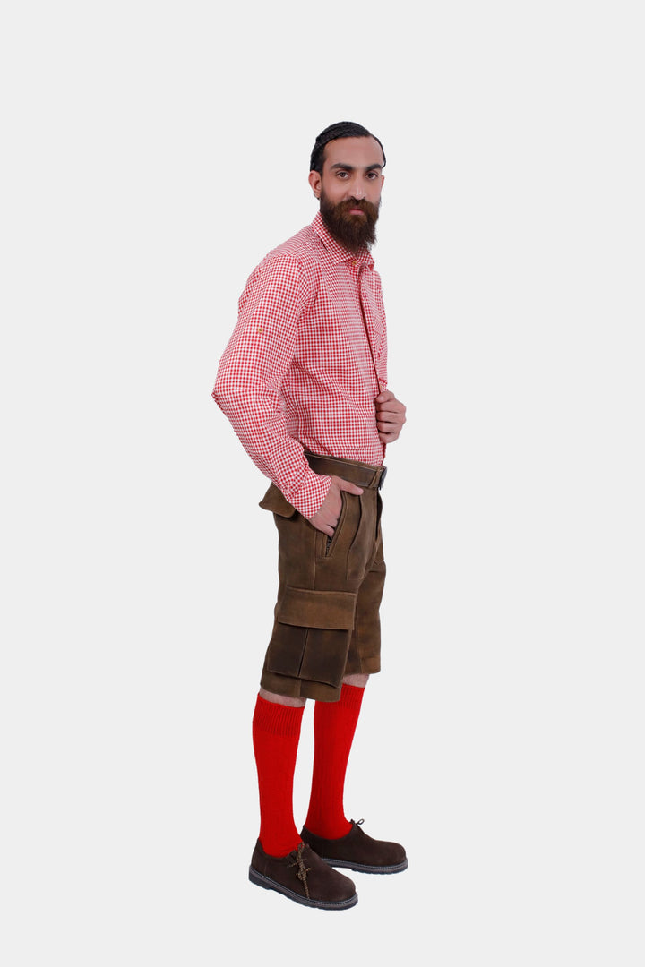 Another side profile of a man in DJ Ötzi Cargo Lederhosen and a red checkered shirt, showing the front and side details of the lederhosen.