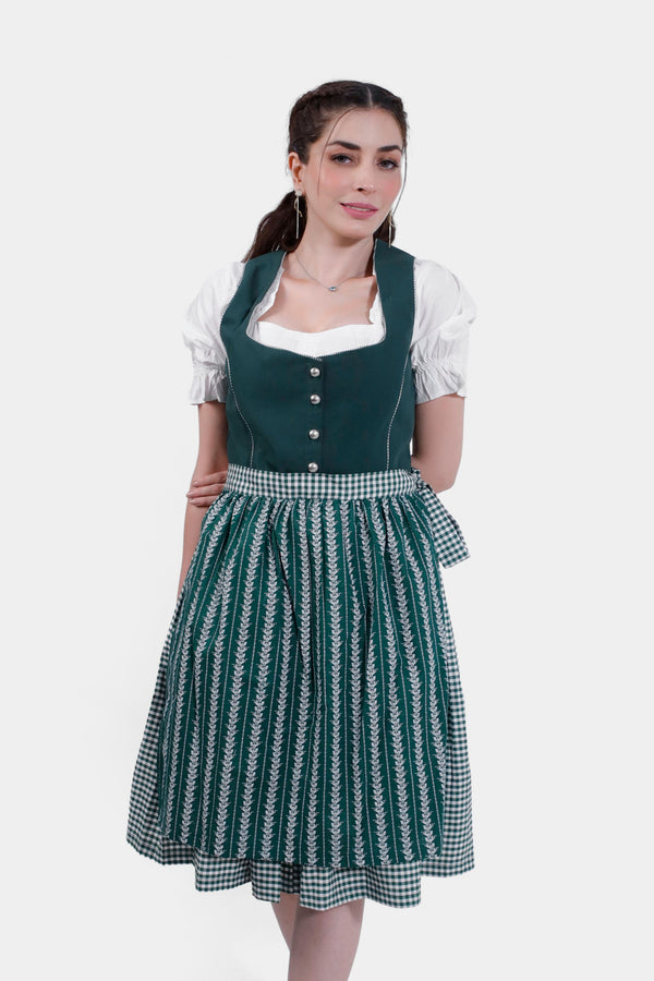 Front view of a woman in Dirndl Sukowa, featuring a deep green bodice, white blouse, and a green patterned skirt with a gingham apron. grünes dirndl , dirndl midi grün