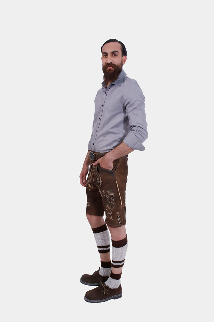 Another angle of a man wearing Ein Prosit Lederhosen, displaying the side profile and intricate embroidery of the leather shorts.