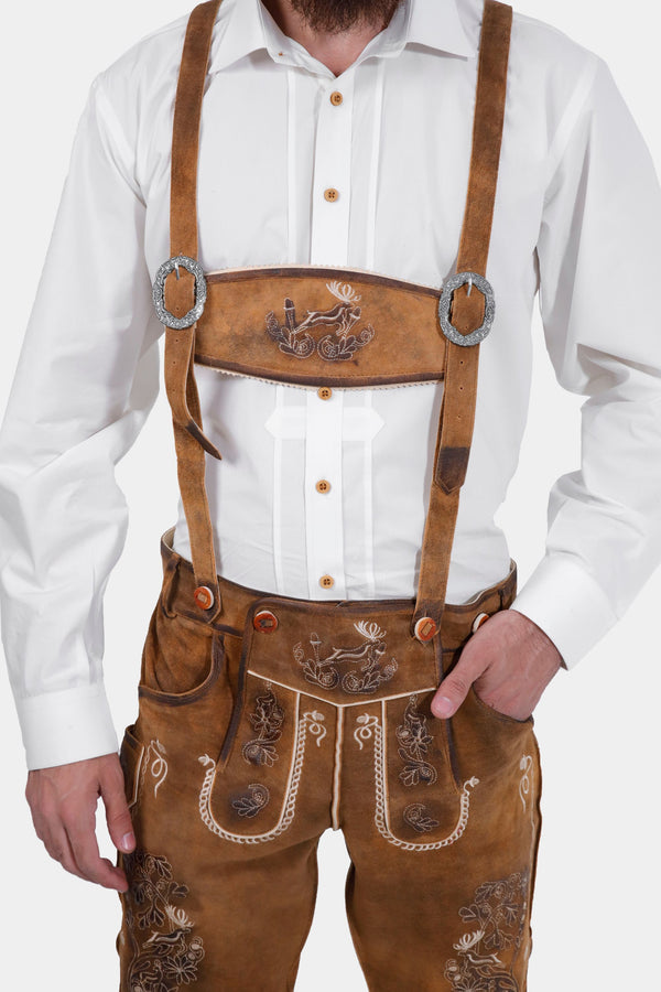 man wearing traditional lederhosen suspenders with intricate embroidery in natural colors
hosenträger für herren​
braune hosenträger