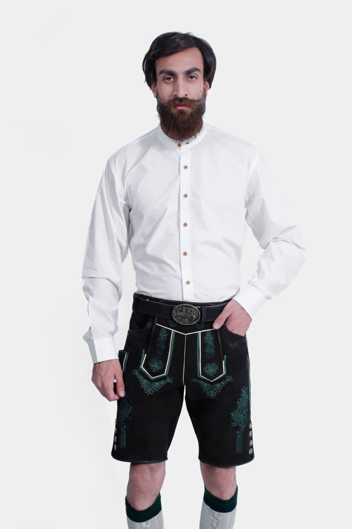 Man wearing Gropius Lederhosen, highlighting the detailed green embroidery on the front and side, and the traditional button accents on the black lederhosen.