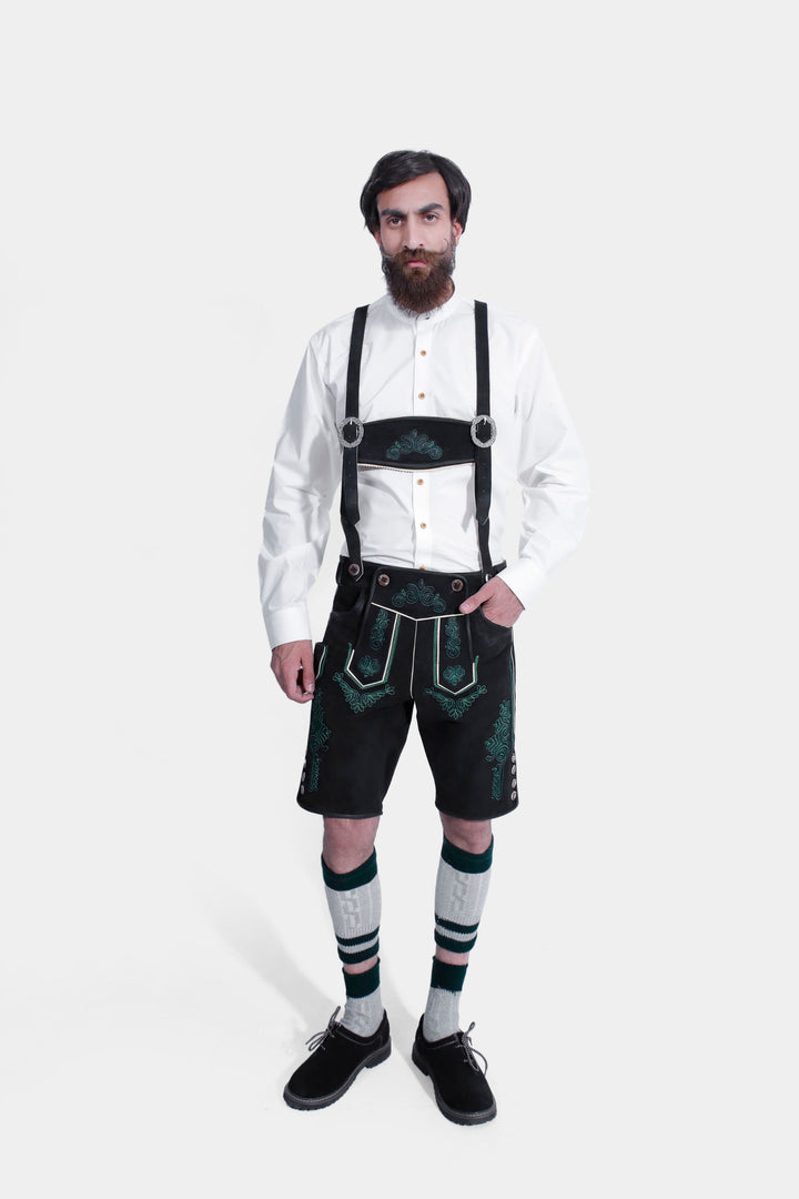 Man wearing Gropius Lederhosen with suspenders, highlighting the embroidered patterns and traditional button details.