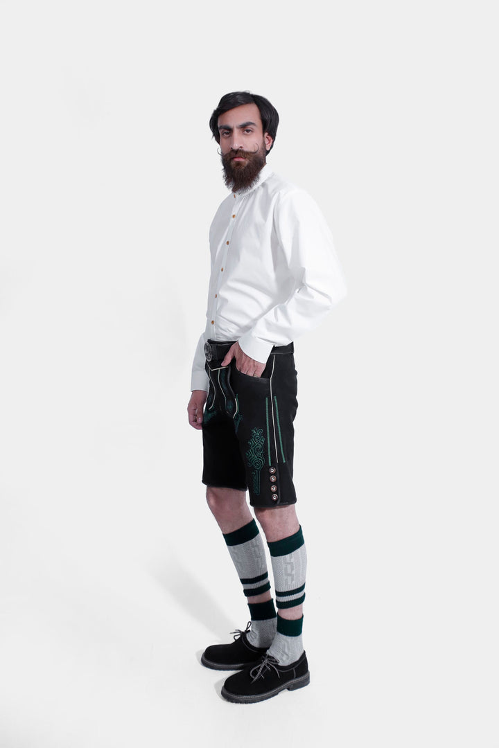 Side pose of Gropius Lederhosen, featuring green embroidery and button details on the side.