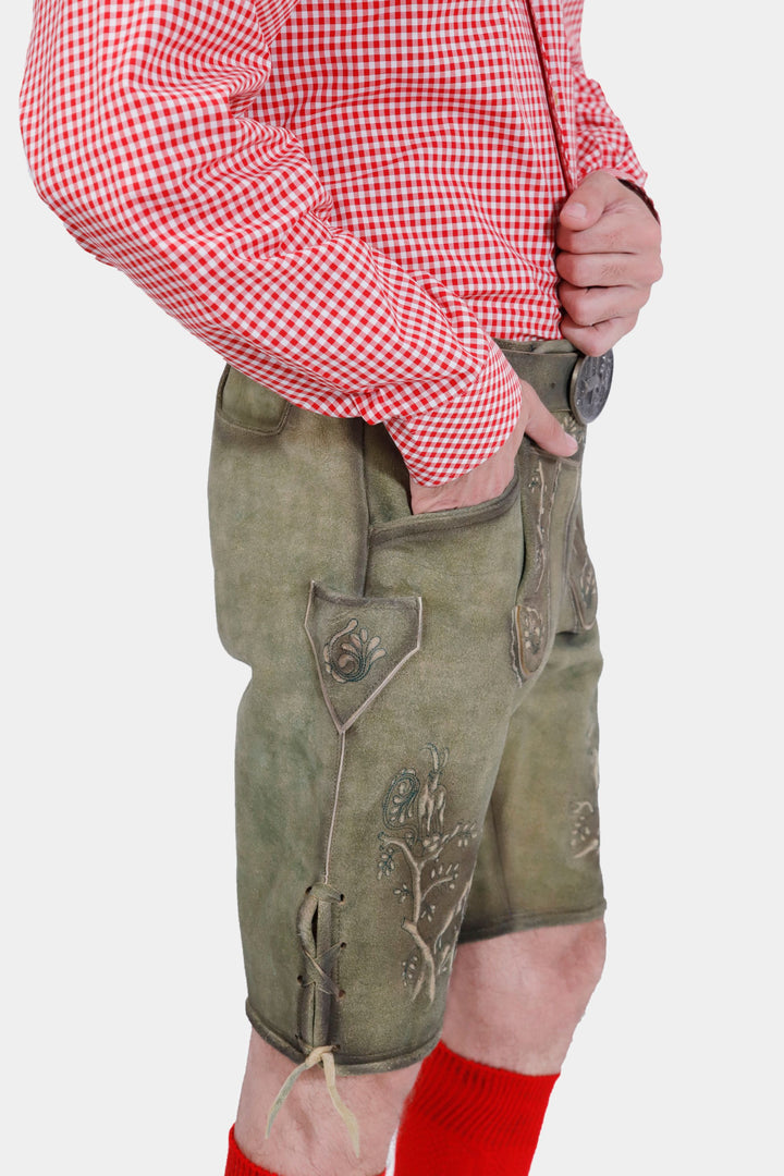 Another close-up side view of the man wearing the Heidelberg Lederhosen, showing the natural embroidery and side pockets.