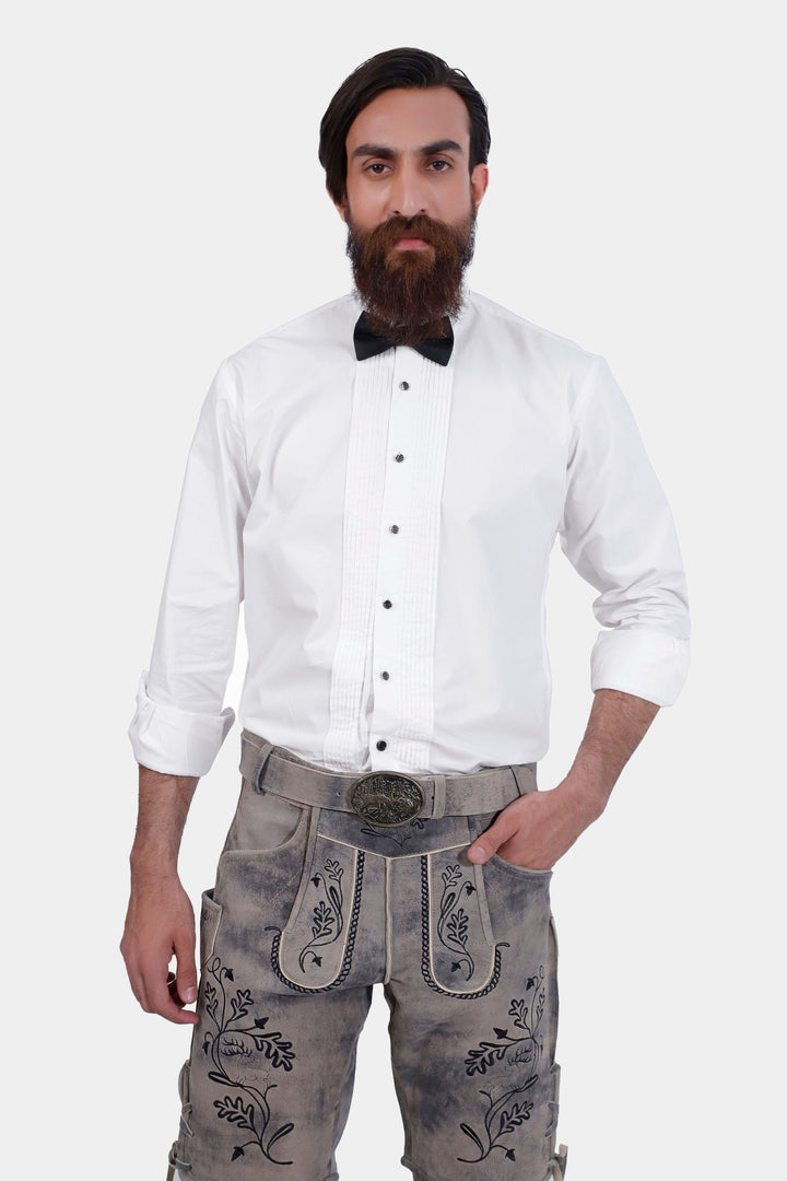 Man wearing Hofburg Lederhosen with white dress shirt and black bow tie, front view.