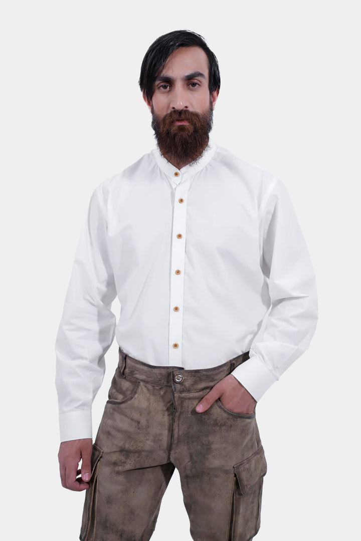 Close-up of a person wearing Königssee Cargo Lederhosen Long Pant with cargo pockets, paired with a white button-up shirt.