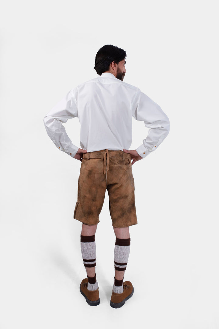 Back view of the man wearing Leavenworth lederhosen, showing the fit and design of the back of the lederhosen.