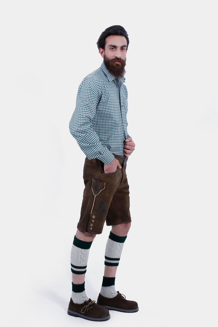 Side view of the man wearing the Mahler Lederhosen, highlighting the pocket detail and the intricate embroidery on the side.