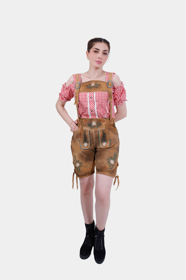 Full front view of a woman in Munich Majesty Lederhosen, showing the entire outfit with the brown horn buttons on the bib and adjustable waistband. damen lederhose braun, braune lederhose damen​