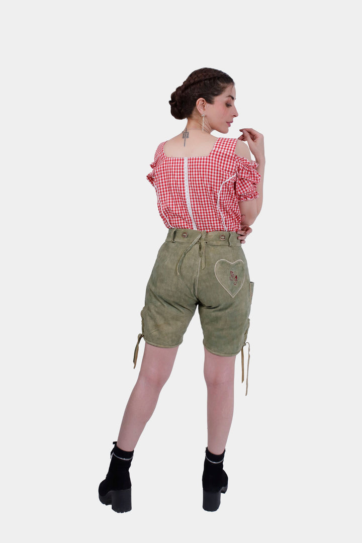 Rear view of a woman in Olivia Charm lederhosen, displaying the back waistband and the overall fit of the shorts.