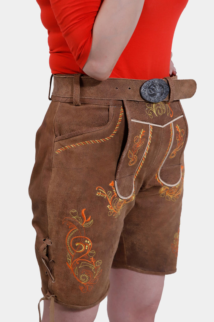 Side view of Queen Victoria Lederhosen showing detailed embroidery, front pockets, and a decorative belt buckle.