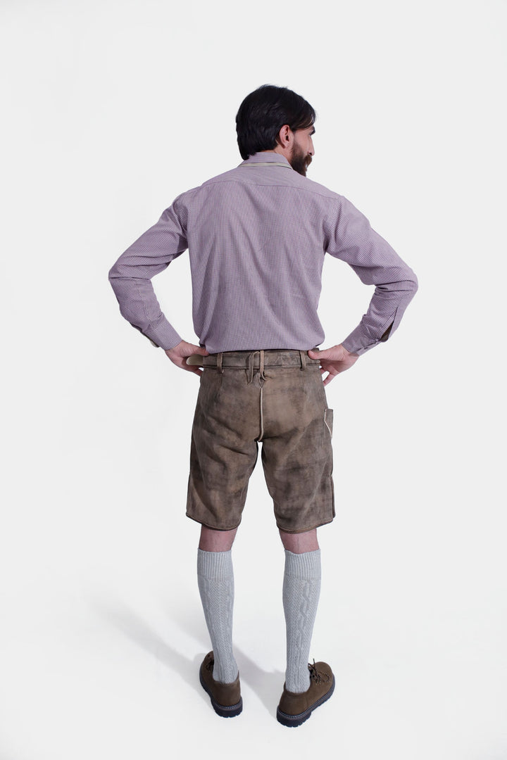 Rear view of man wearing Raphael Lederhosen, hands on hips, showcasing the back design.