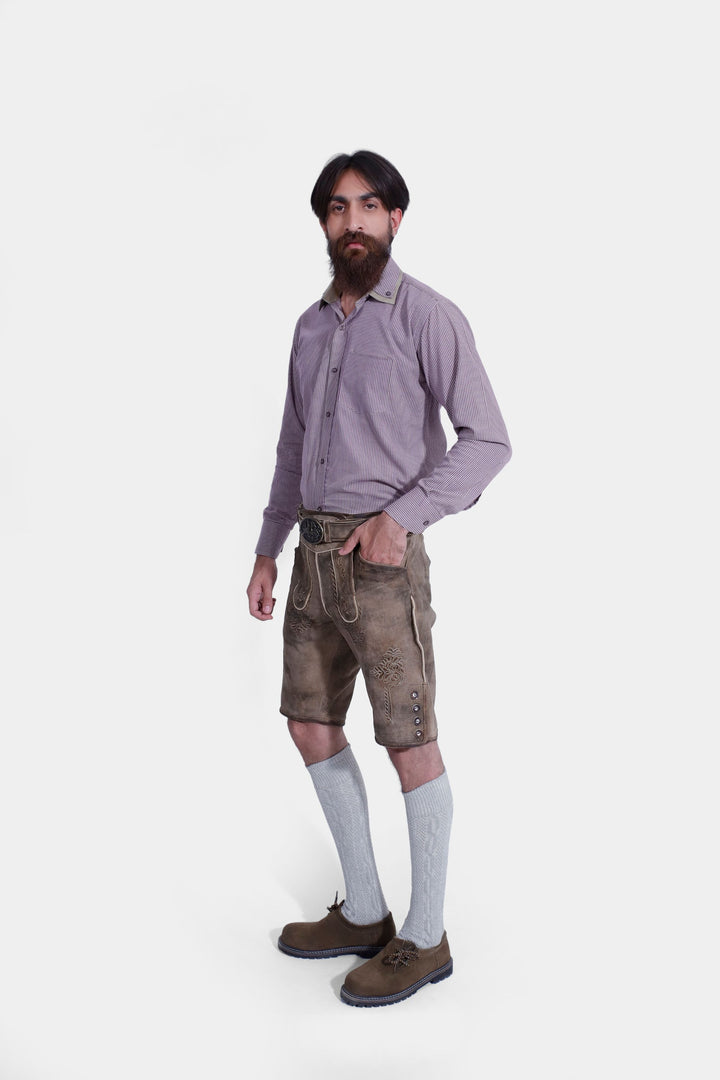 Side profile of man wearing Raphael Lederhosen with checkered dress shirt, and gray knee-high socks.