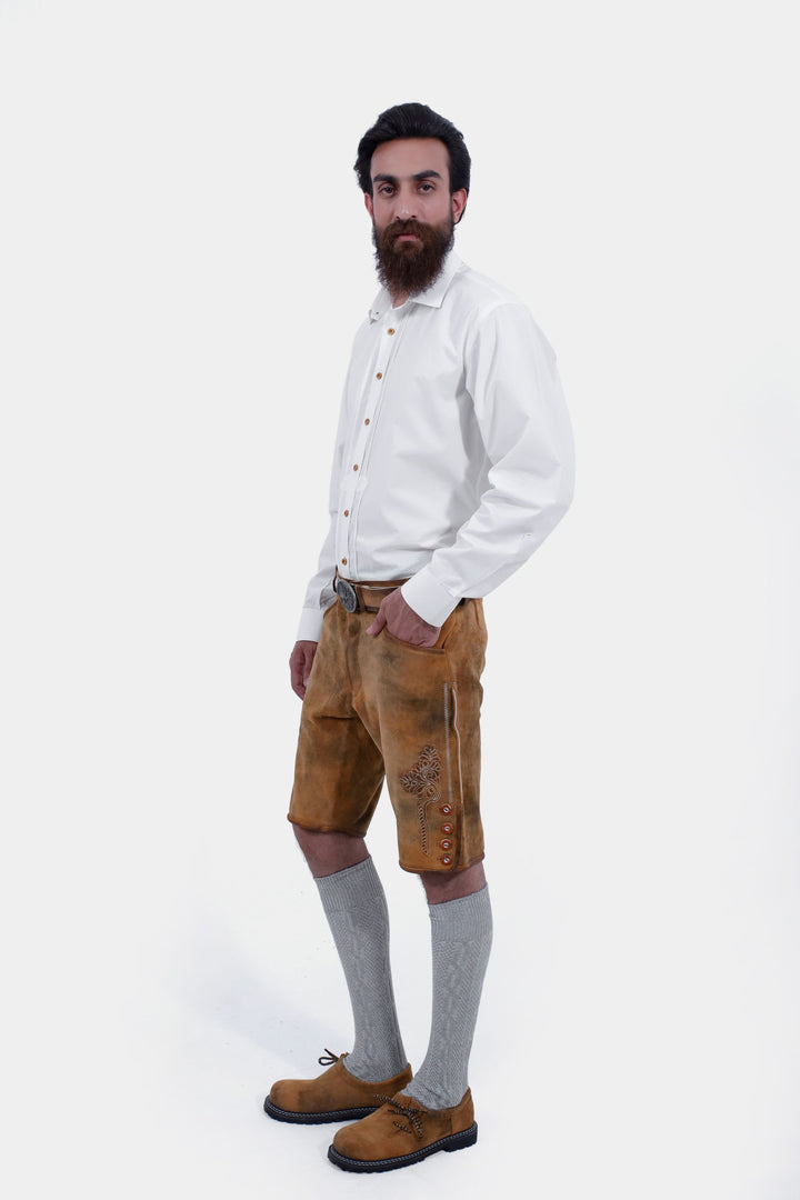 Side view of the man wearing the Rothenburg Lederhosen, highlighting the pocket detail and intricate embroidery on the side.