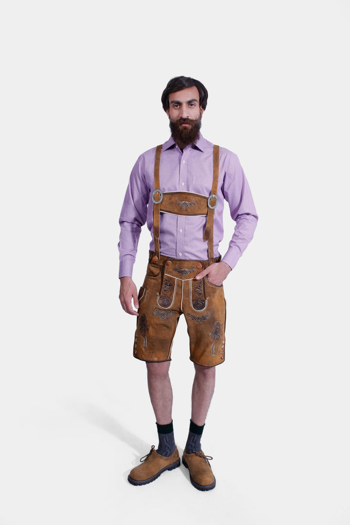 complete view of a man wearing traditional lederhosen suspenders