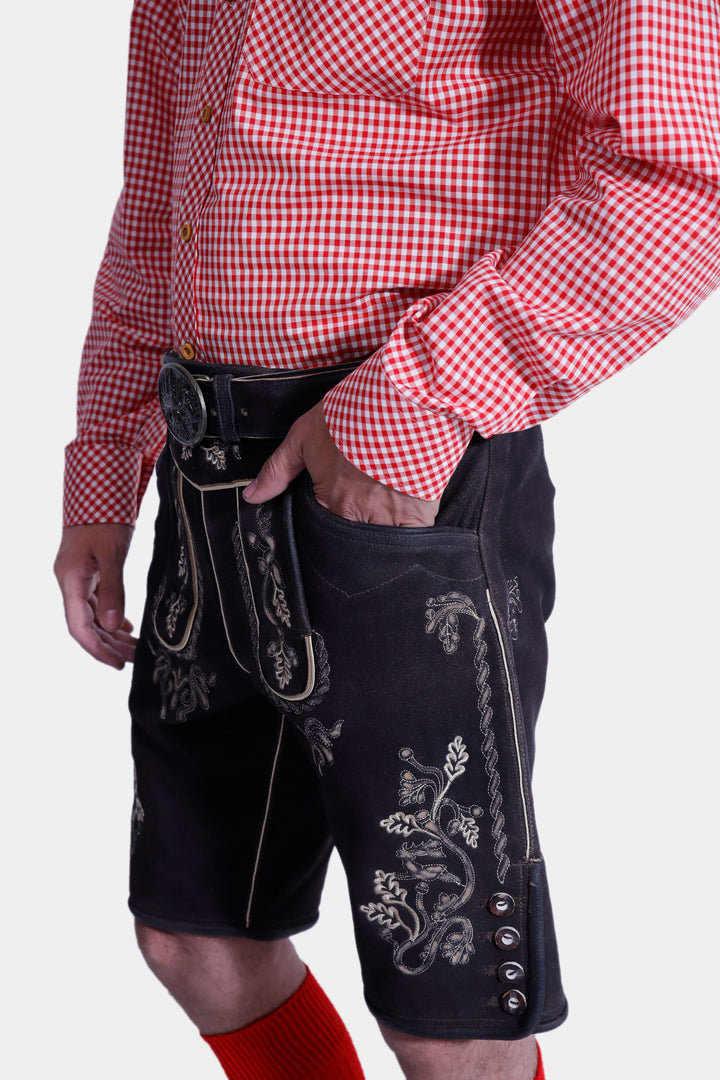 Close-up view of Steuben Lederhosen, highlighting the intricate embroidery, belt, and craftsmanship of the traditional Bavarian leather shorts. 