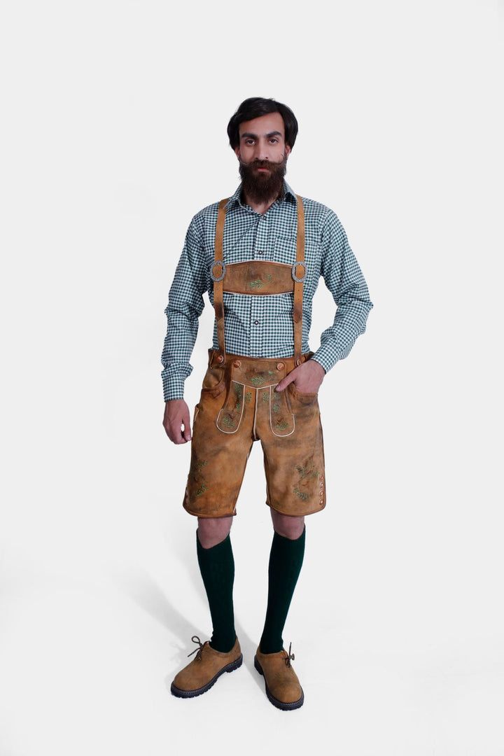 complete view of a man wearing traditional lederhosen suspenders