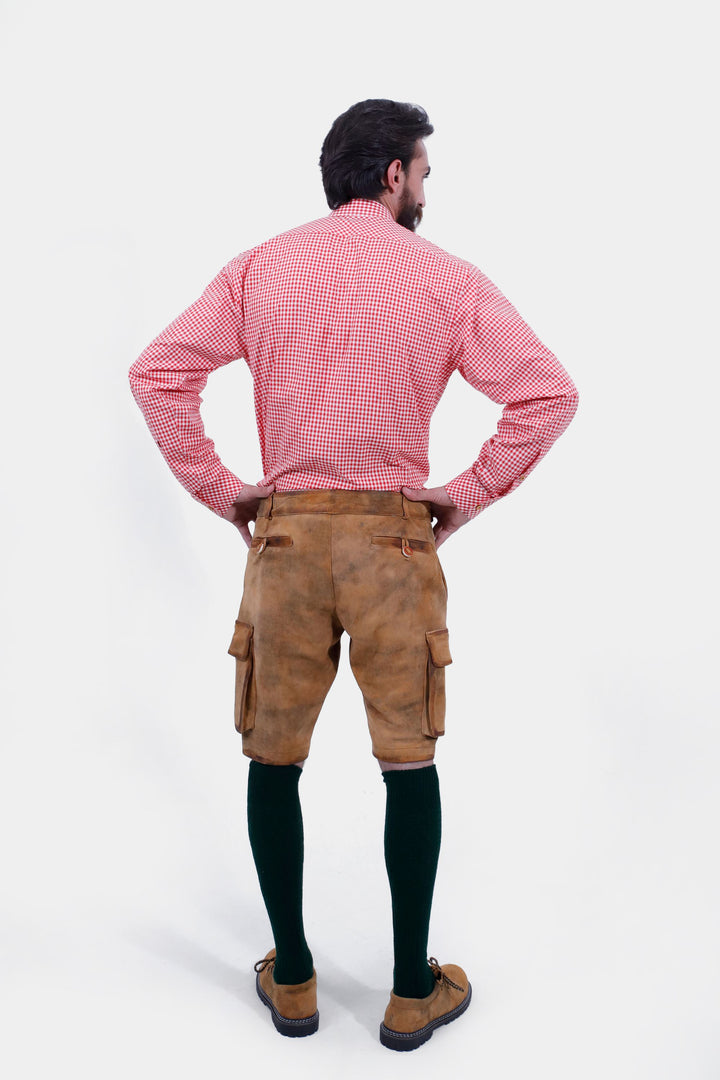 Rear view of a man wearing Wagner Cargo Lederhosen, showcasing the back pockets and detailed stitching of the traditional Bavarian leather shorts.