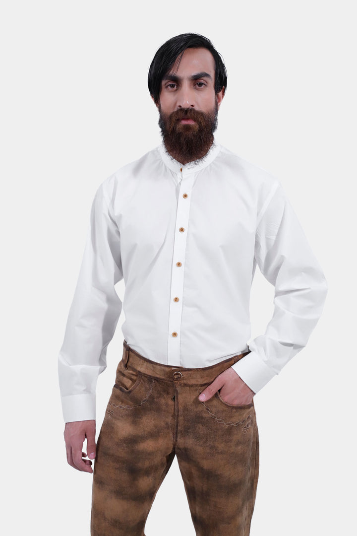 lose-up of a person wearing Zugspitze Lederhosen Long Pant with detailed stitching, paired with a white button-up shirt.