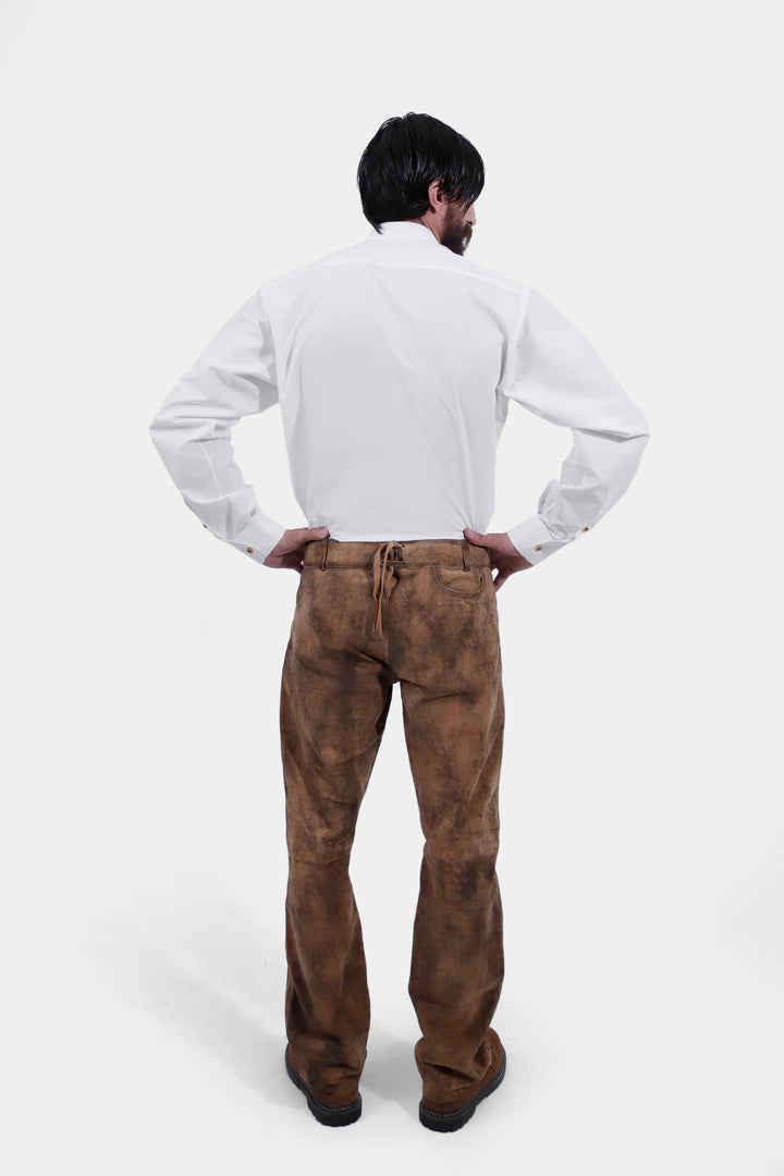 Rear view of a person showing the back of Zugspitze Lederhosen Long Pant with a pocket detail, wearing a white button-up shirt.