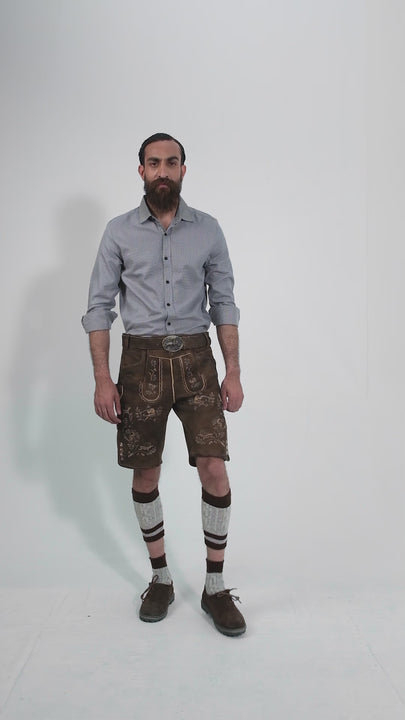 Man showcasing Ein Prosit Lederhosen, rotating to display all angles of the outfit, including front, side, and back views.