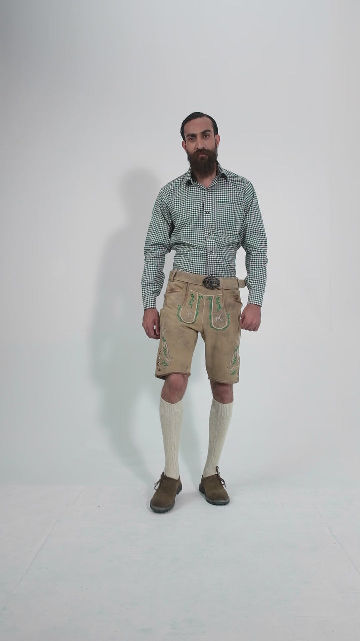 Man showcasing Luther Lederhosen, rotating to display all angles of the outfit, including front, side, and back views.