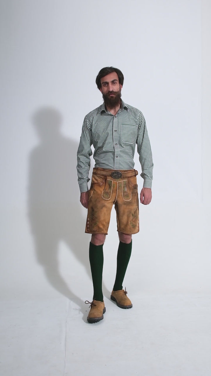 Man showcasing Titisee Lederhosen, rotating to display all angles of the outfit, including front, side, and back views.