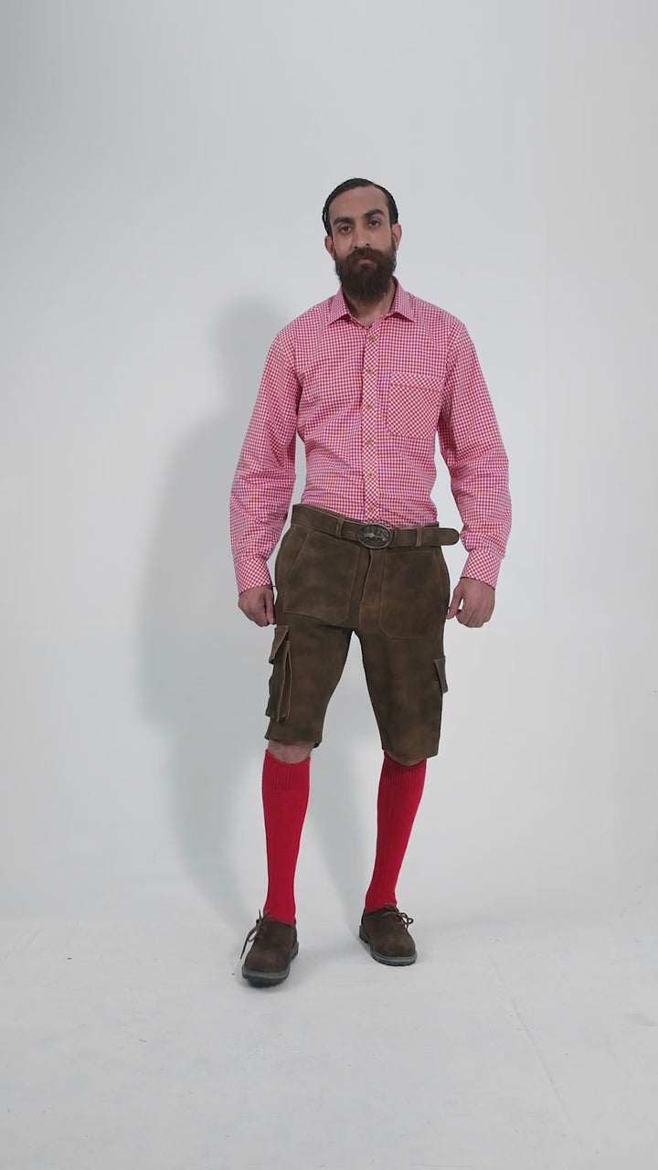 Man showcasing DJ Ötzi Cargo Lederhosen, rotating to display all angles of the outfit, including front, side, and back views.