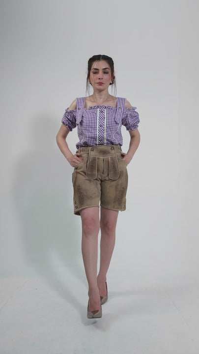 Showcase video of the Hamburg Lederhosen, highlighting the product's detailed craftsmanship, rich suede texture, and stylish embroidery through various model poses and close-up shots.