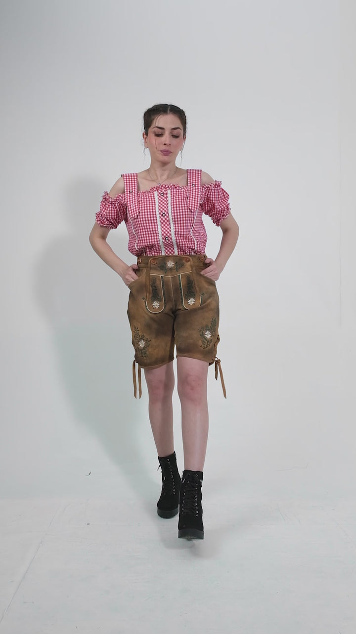 Showcase video of the Munich Majesty Lederhosen, highlighting the product's detailed craftsmanship, rich suede texture, and stylish embroidery through various model poses and close-up shots.