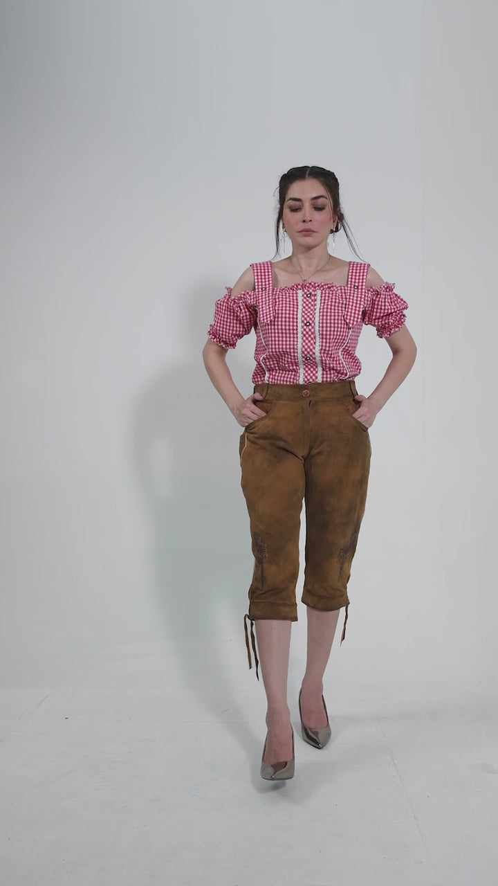 Showcase video of the Kristen Dunst Lederhosen, highlighting the product's detailed craftsmanship, rich suede texture, and stylish embroidery through various model poses and close-up shots.