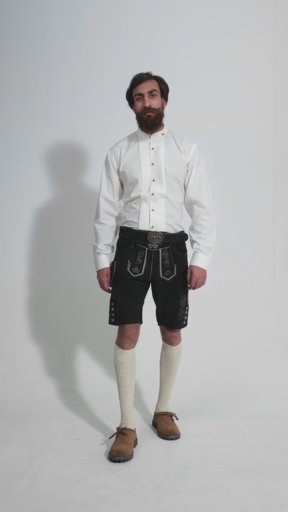 Man showcasing Oktoberfest Appleton Lederhosen, rotating to display all angles of the outfit, including front, side, and back views.