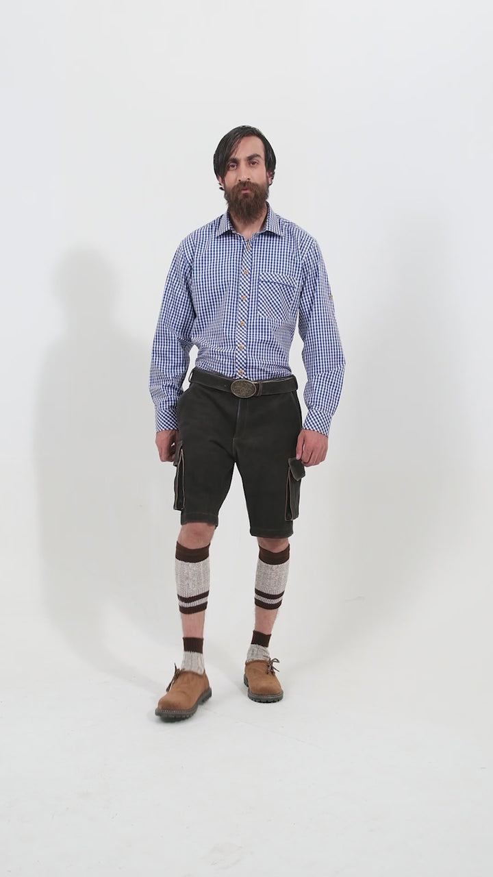 Man showcasing Manor Oktoberfest Cargo Lederhosen Lederhosen, rotating to display all angles of the outfit, including front, side, and back views.